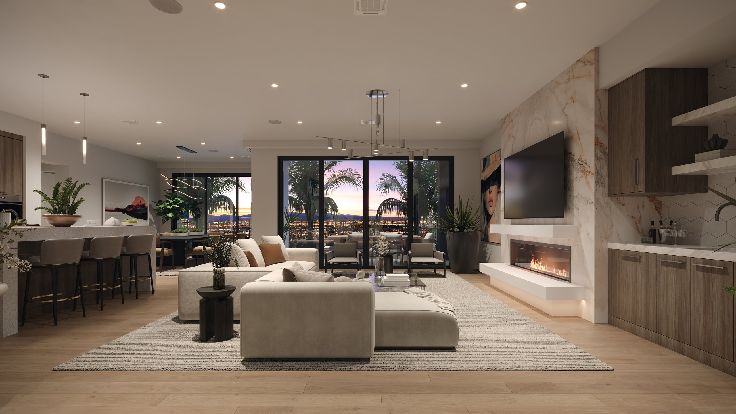 A Rocky Ridge great room at dusk, with sliding glass doors open to a terrace and the city lights of the valley beyond, a linear fireplace and an open kitchen.