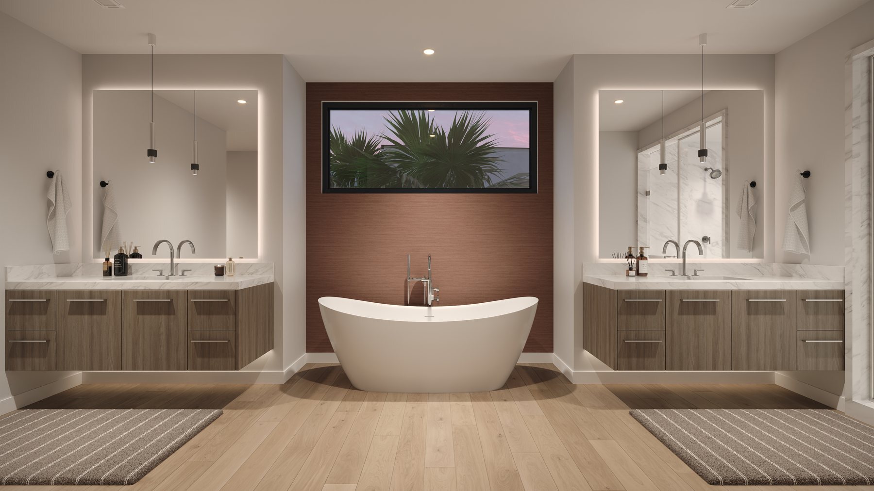 A master bath at Rocky Ridge with twin floating vanities, backlit mirrors, a freestanding tub and a window above it.