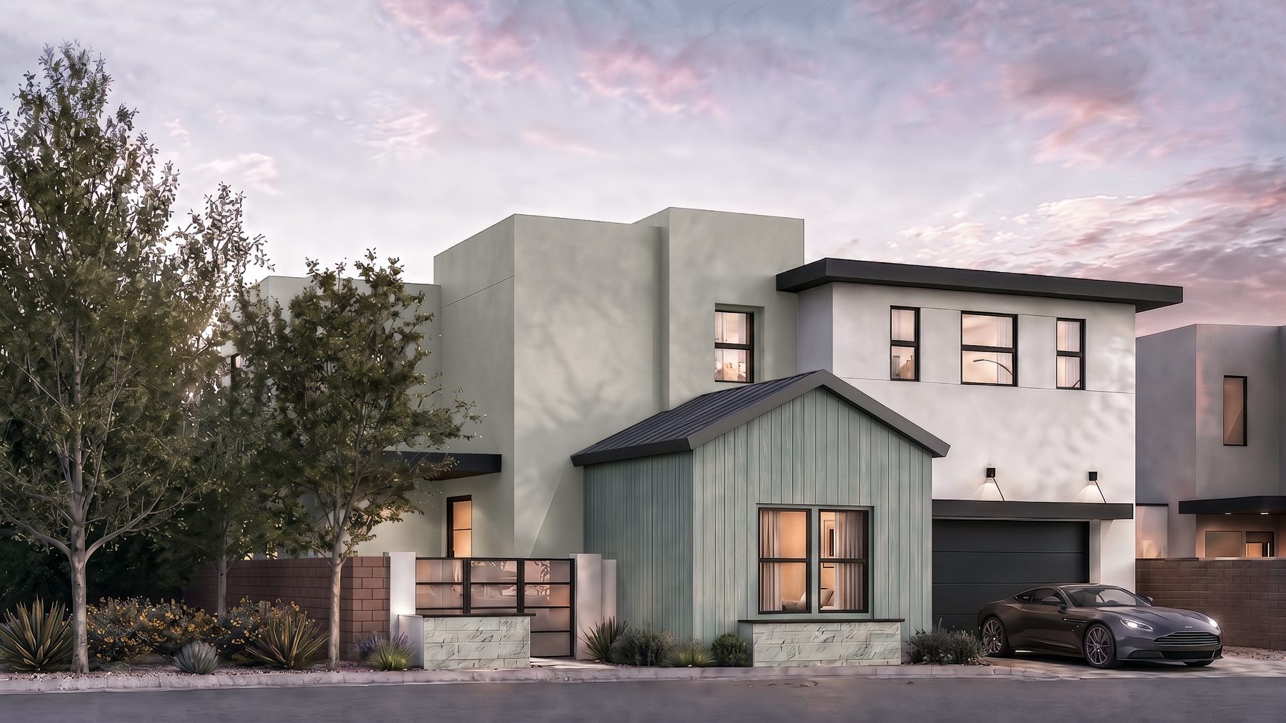 Residence 3 at Rocky Ridge at dusk. Color scheme 5, with a projecting gable bay in vertical siding and a two-car garage.