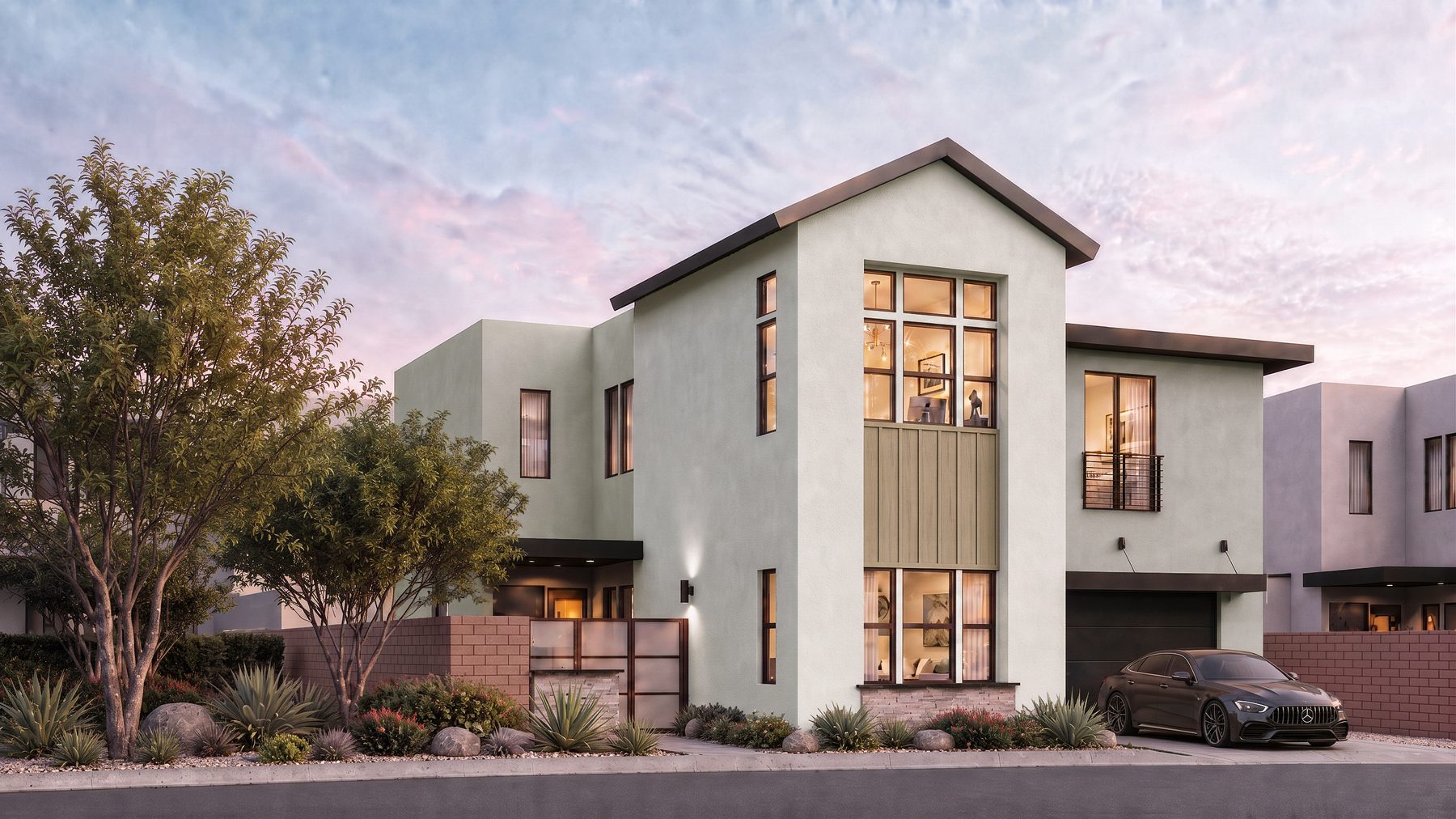 Residence 4 at Rocky Ridge at dusk. Color scheme 3, with a tall gable over the two-story foyer window beside a flat roof wing.